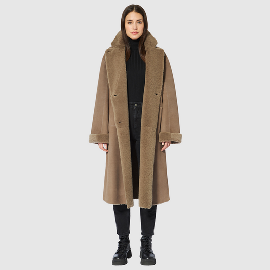 Reversible suede loose fitting coat Reverses to curly wool teddy Slight drop shoulder Double breasted button closure