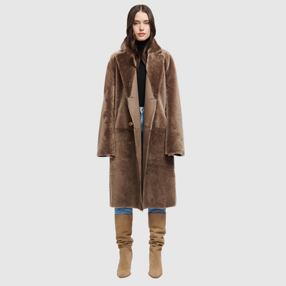 Reversible suede loose fitting coat Reverses to iron wool teddy Slight drop shoulder Double breasted button closure