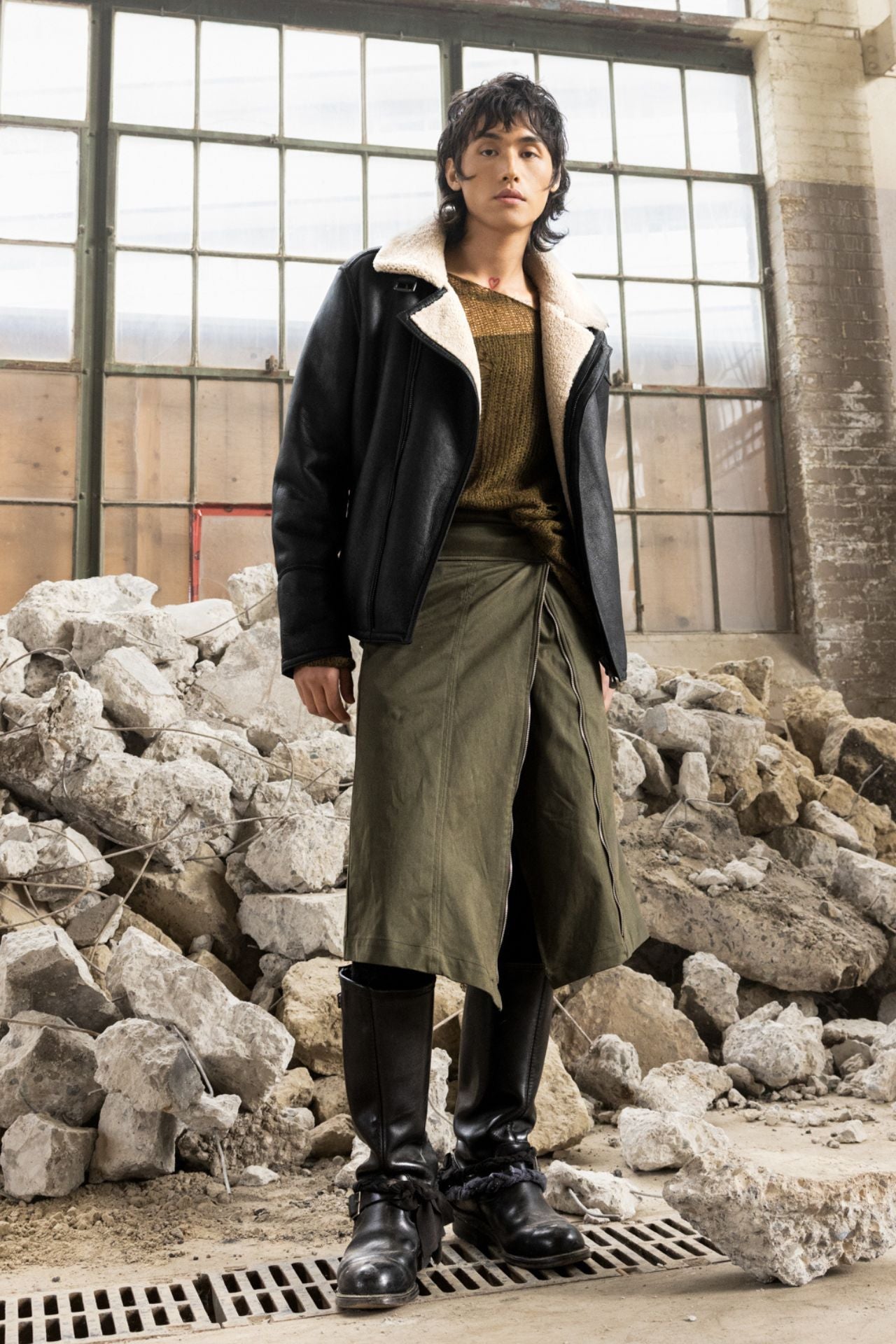 Elevate your outerwear collection with our men's nappa shearling moto jacket. This stylish piece fits true to size and features an asymmetrical zip closure, spread collar, and interior zip pocket. Perfect for a modern, sophisticated look.