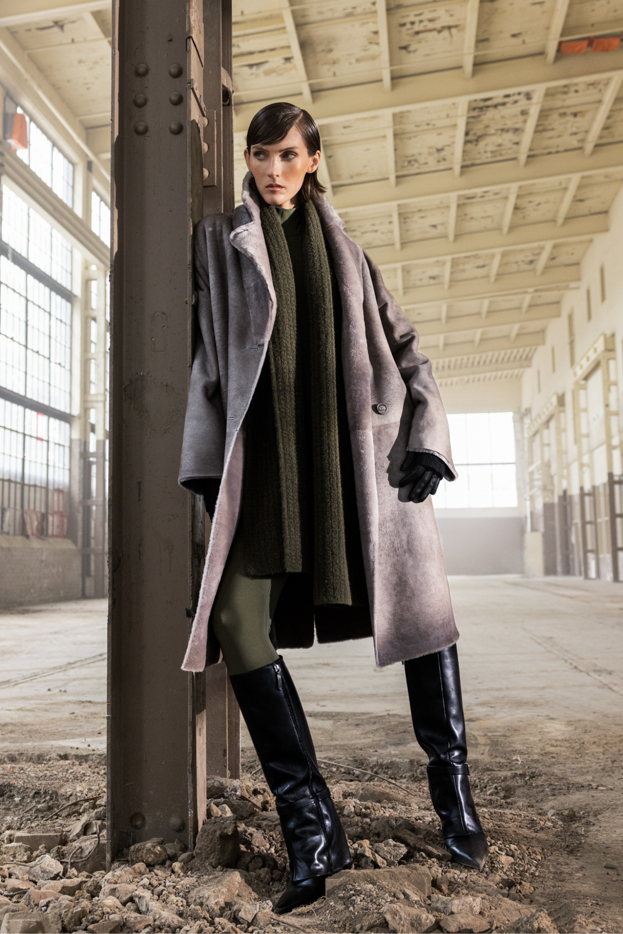 Elevate your outerwear wardrobe with our women's reversible suede loose fitting coat. This versatile winter coat reverses to an iron wool teddy, offering a slight drop shoulder and a back vent for comfort. It features single welt side pockets on the suede side and slash side pockets on the reversed iron wool side. The double-breasted button closure adds a stylish touch, making it a must-have fashion coat for every occasion.