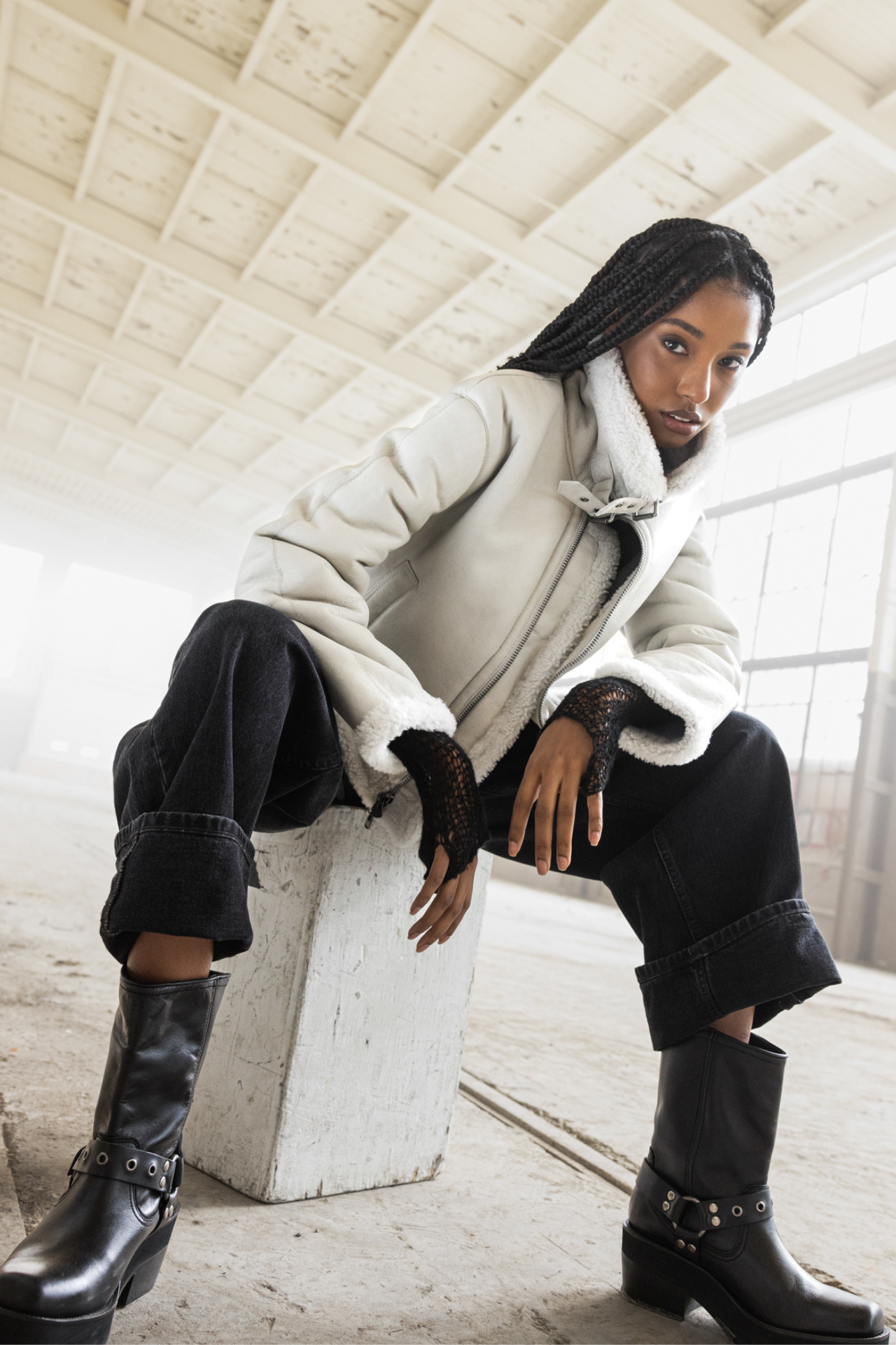 Elevate your outerwear collection with our nappa cropped moto jacket. Featuring a regular shoulder, curly wool collar and trims, double buckle detail on the collar, and a straight fit through the torso. It includes an interior zip pocket, exterior slash side pockets, and a front zip closure. Perfect for a stylish and functional look.