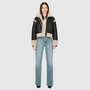 Reversible oversized cropped jacket curly wool and nappa combination Drop shoulder Tapered at hem Standard front zip closure Side and interior zip pockets