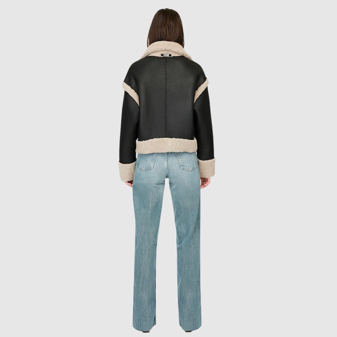 Reversible oversized cropped jacket curly wool and nappa combination Drop shoulder Tapered at hem Standard front zip closure Side and interior zip pockets