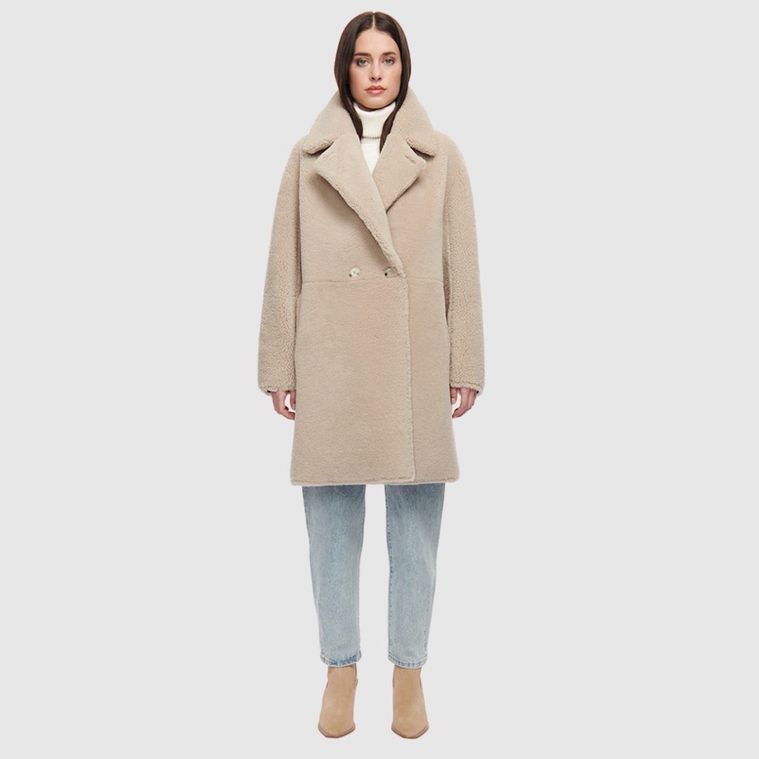 80s inspired reversible notch collar nappa coat Oversized loose fitted style Reverses to curly wool teddy Relaxed dropped shoulder Button closure Slash pockets