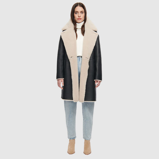 80s inspired reversible notch collar nappa coat Oversized loose fitted style Reverses to curly wool teddy Relaxed dropped shoulder Button closure Slash pockets