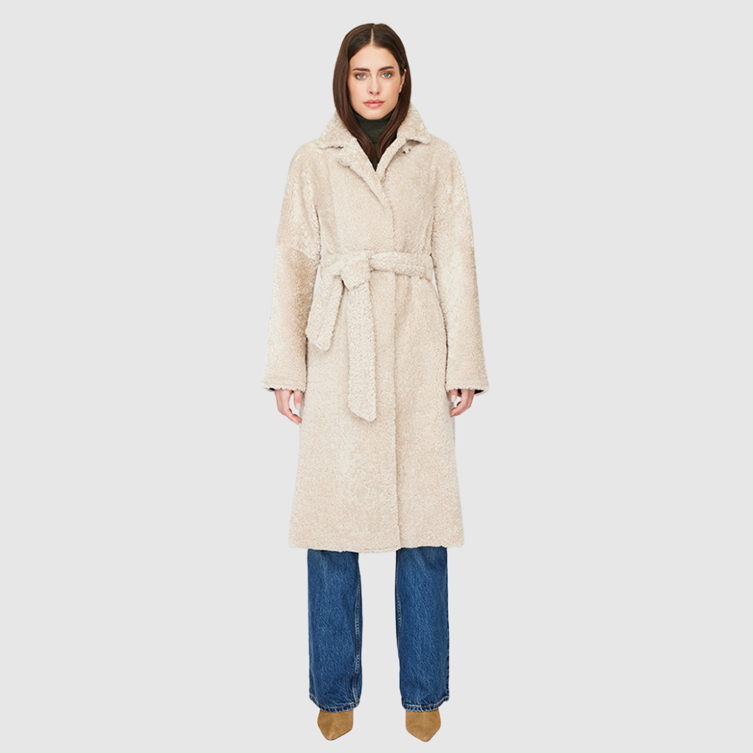 Knee length mouton teddy wool coat Fitted a-line silhouette Notch collar Center front three button closure with tie wrap Slash pockets Fully lined