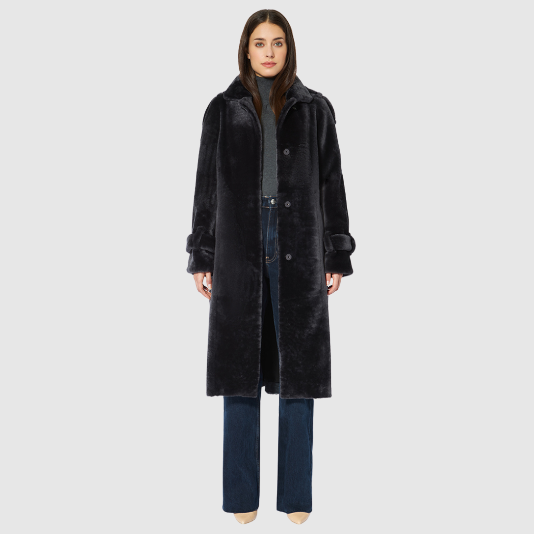 Mouton wool coat Relaxed a-line silhouette Notch collar Drop shoulder with epaulets Strap detailing on cuffs Tie belt at waist Snap closure Slash pockets Fully lined