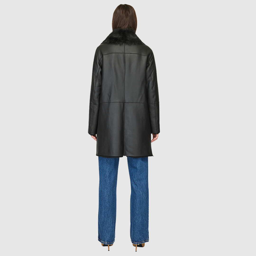 Nappa coat with raw edge finish Toscana shawl collar with buckle Regular shoulder Side zip pockets Interior zip pocket Asymmetrical zip closure 