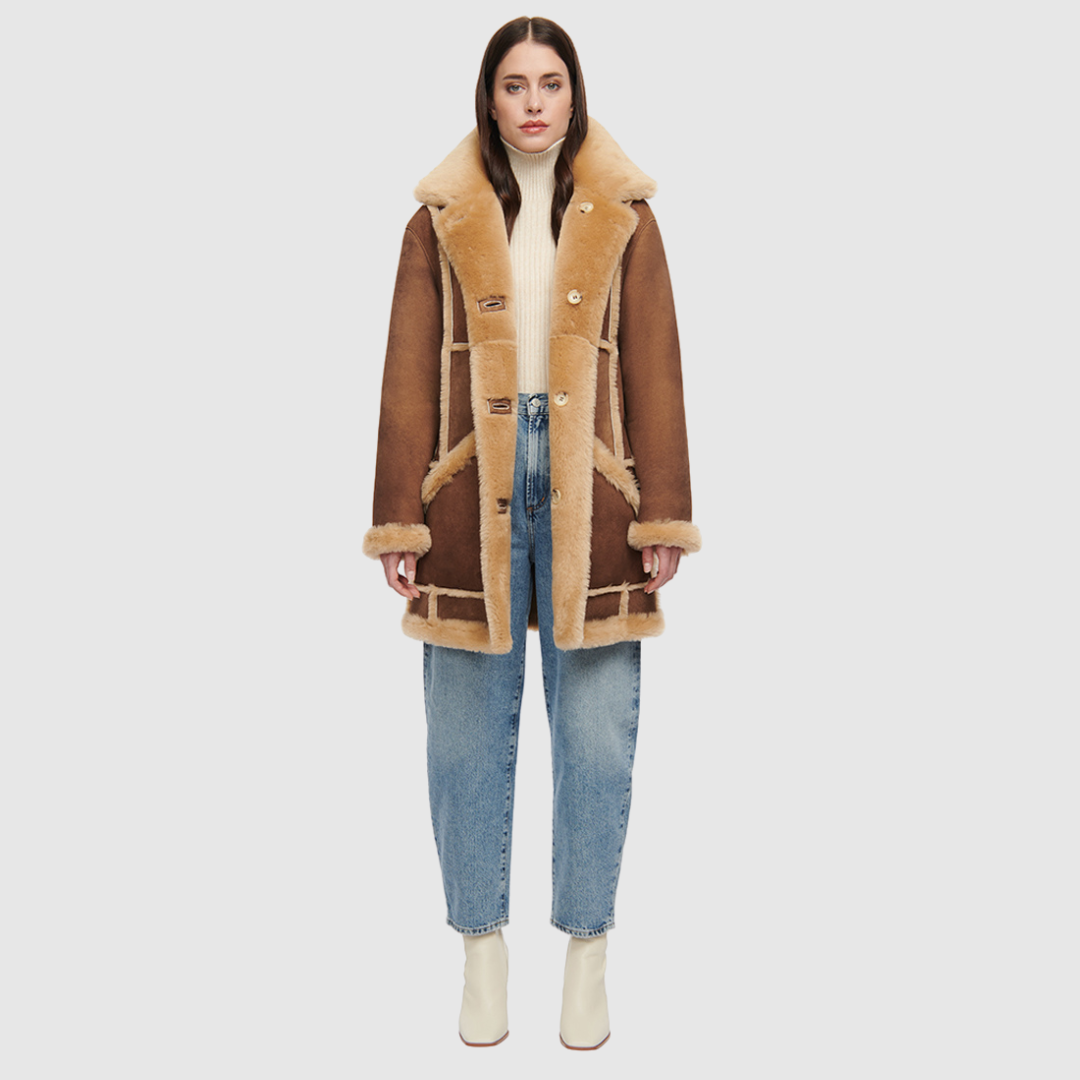 Vintage inspired reversible suede parka Reverses to an iron wool teddy Drop shoulder Oversized fit through shoulders and torso Notch collar Contrast curly wool seam details Patch side pockets on both suede and iron wool teddy side Front button closure