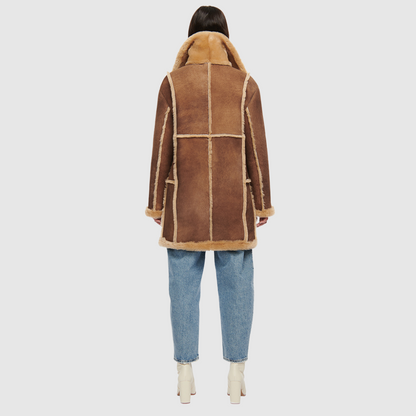 Vintage inspired reversible suede parka Reverses to an iron wool teddy Drop shoulder Oversized fit through shoulders and torso Notch collar Contrast curly wool seam details Patch side pockets on both suede and iron wool teddy side Front button closure
