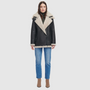 Relaxed medium length nappa moto shearling Drop shoulder Curly wool collar and trims Interior zip pocket
