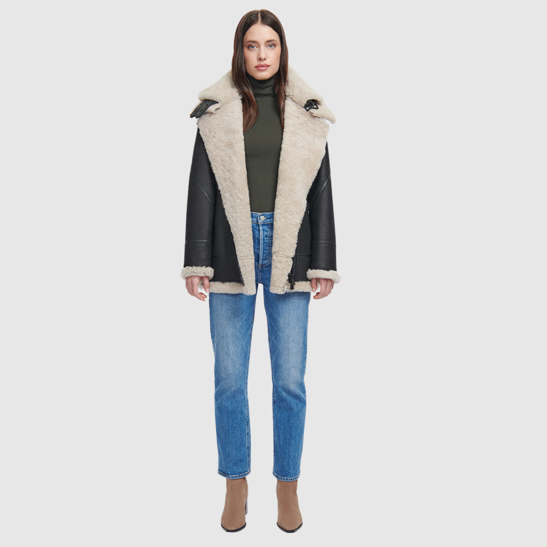 Relaxed medium length nappa moto shearling Drop shoulder Curly wool collar and trims Interior zip pocket