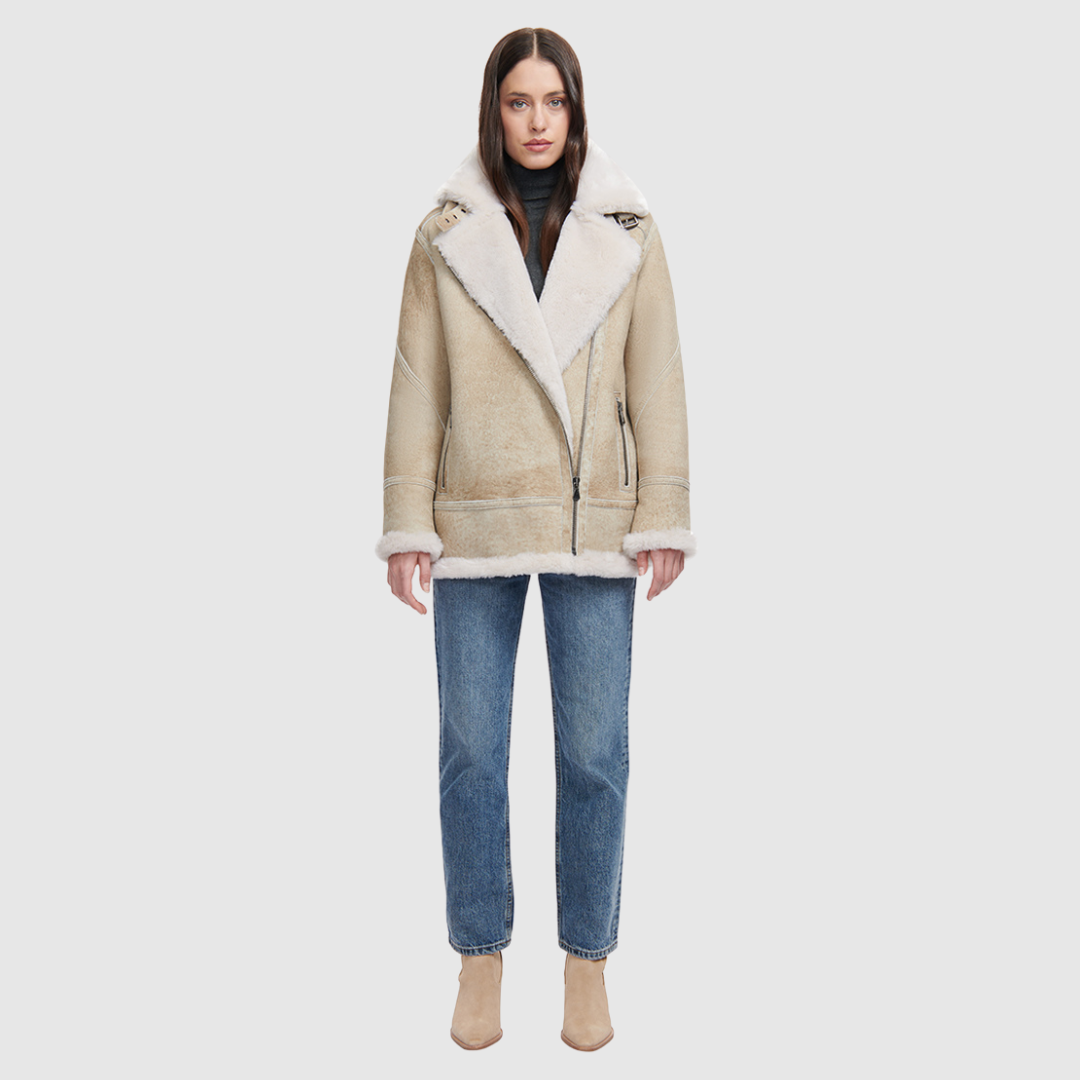 Suede relaxed medium length moto Ironed wool collar and trims Drop shoulder Detachable hood Asymmetrical front zip closure Exterior zip pockets Hidden inside pockets