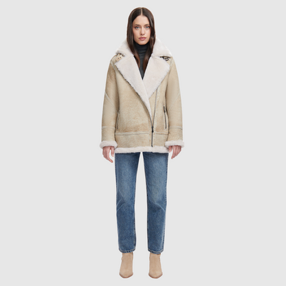 Suede relaxed medium length moto Ironed wool collar and trims Drop shoulder Detachable hood Asymmetrical front zip closure Exterior zip pockets Hidden inside pockets