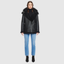 The HiSO Martina Jet Shearling is crafted with a Nappa material and features a relaxed medium length. Along with a curly wool collar and trims, it includes a drop shoulder design and a detachable hood for added convenience. The asymmetrical front zip closure and exterior zip pockets add a sleek touch, while hidden inside pockets provide added functionality.
