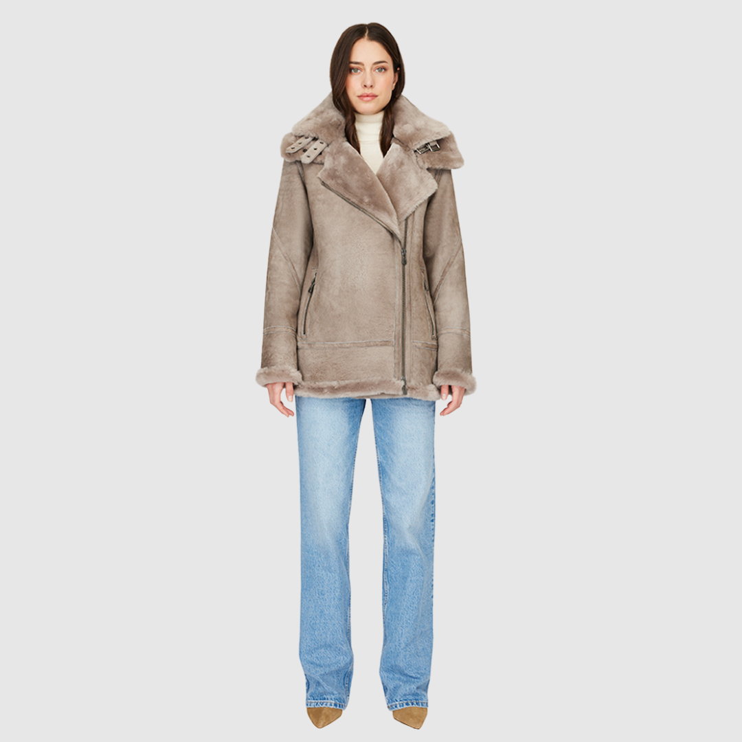 Suede relaxed medium length moto Ironed wool collar and trims Drop shoulder Detachable hood Asymmetrical front zip closure Exterior zip pockets Hidden inside pockets