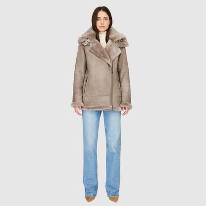 Suede relaxed medium length moto Ironed wool collar and trims Drop shoulder Detachable hood Asymmetrical front zip closure Exterior zip pockets Hidden inside pockets