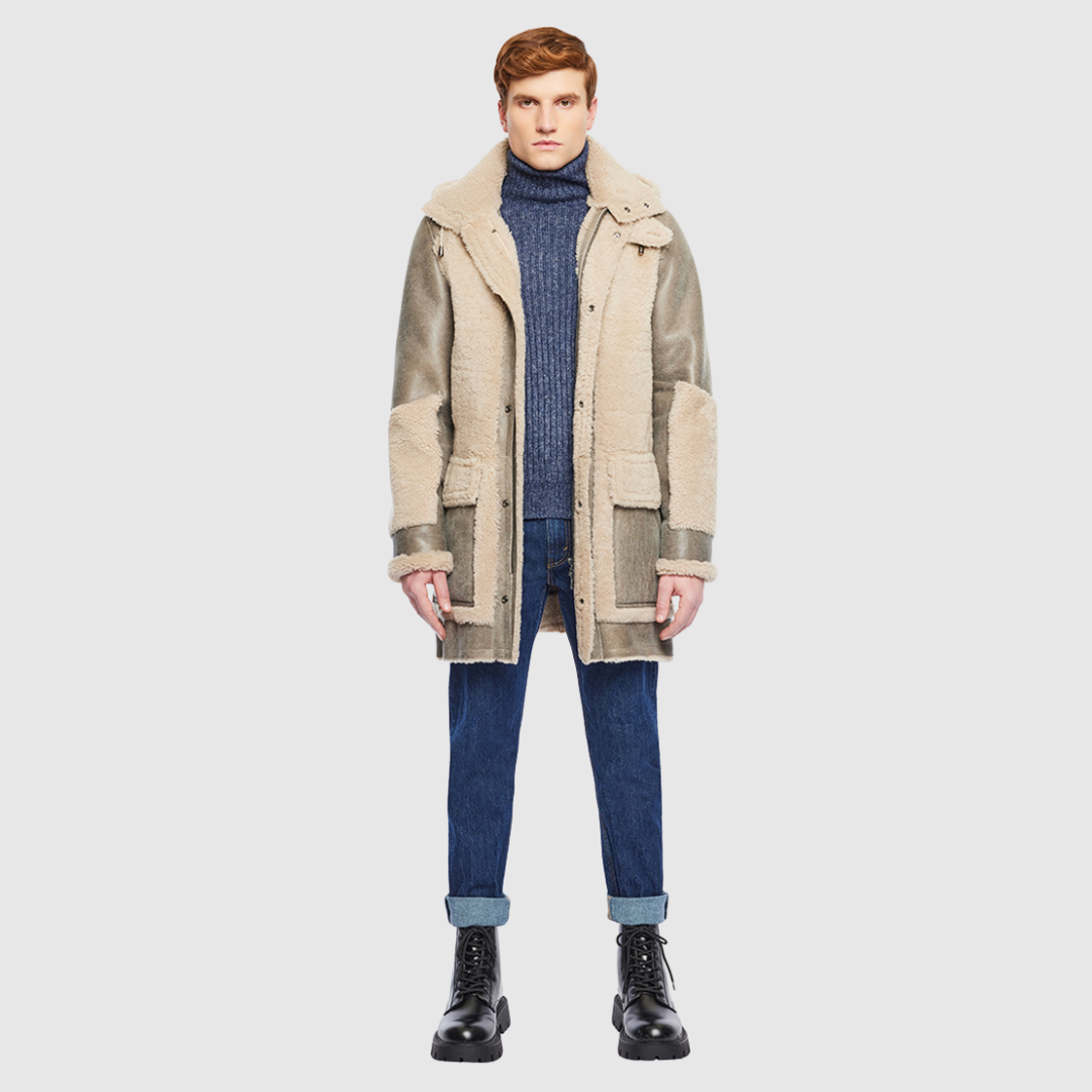 The Octavian Nougat Shearling Parka is a modern mixed-media outerwear piece designed for versatility and functionality. Crafted with contrast curly wool exterior detailing and a removable hood, it features a slightly oversized fit with a regular shoulder for ease of movement. Oversized patch pockets and a front zip closure combine practicality with contemporary style, making it a cold-weather essential.