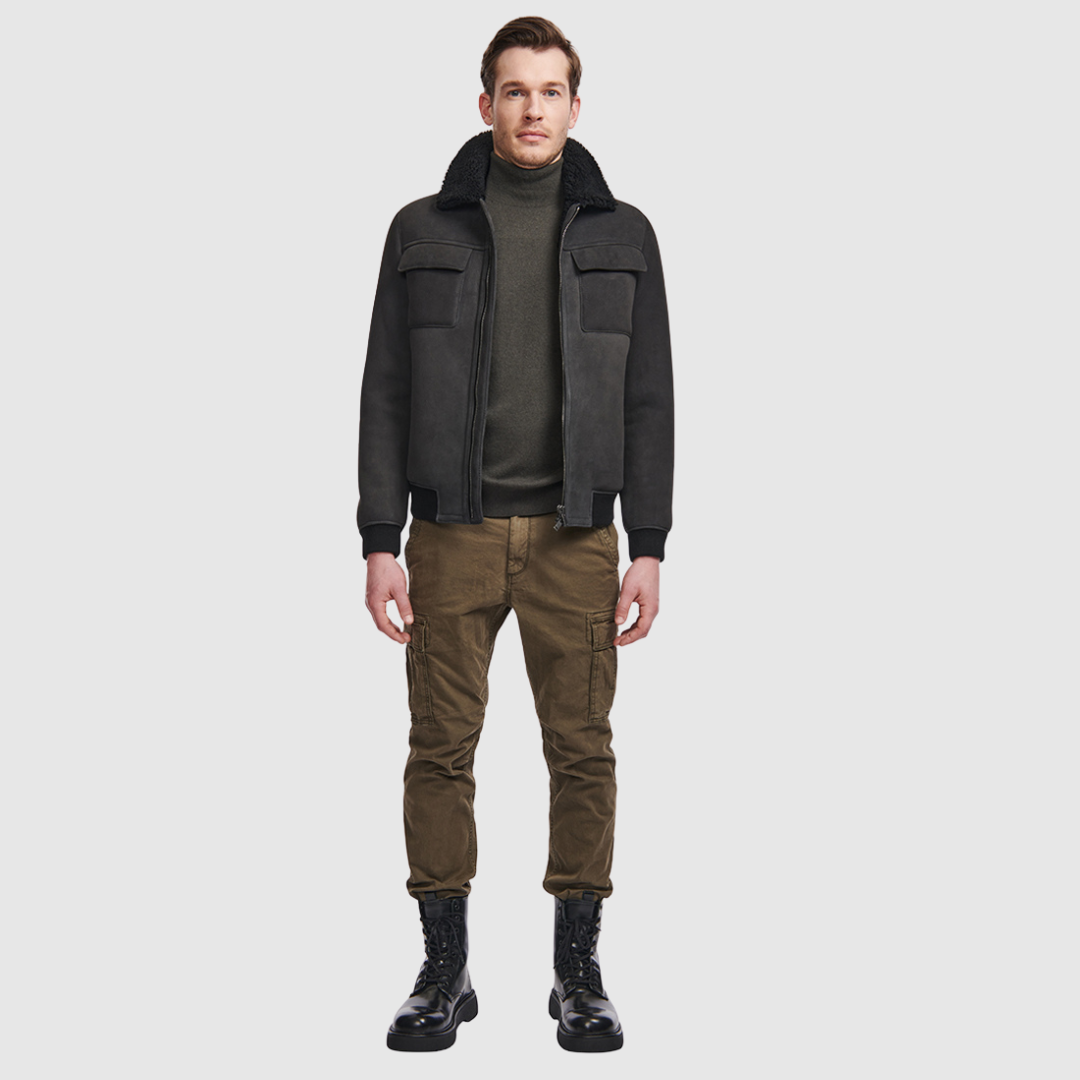 Suede bomber with curly wool collar Fits true to size Rib cuffs and waistband Standard zip closure Zip pockets Interior zip pocket