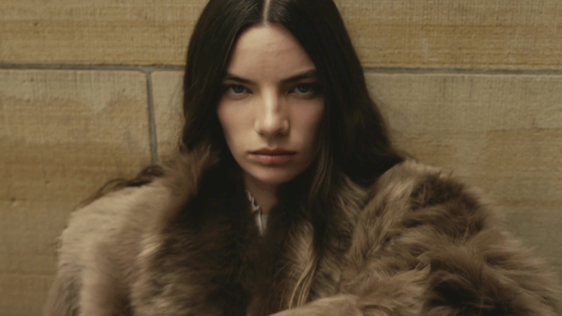 FW25 campaign video featuring HiSO’s luxury outerwear collection. Models move through striking urban and natural settings wearing bold shearling and wool coats that fuse fashion-forward design with functional innovation. Reversible silhouettes and versatile details highlight the brand’s craftsmanship and heritage, offering multiple looks in one piece. Oversized collars, textured shearling, and sleek tailoring embody HiSO’s modern revival of the classic coat—engineered to defy the cold with style.