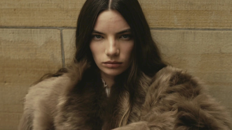 FW25 campaign video featuring HiSO’s luxury outerwear collection. Models move through striking urban and natural settings wearing bold shearling and wool coats that fuse fashion-forward design with functional innovation. Reversible silhouettes and versatile details highlight the brand’s craftsmanship and heritage, offering multiple looks in one piece. Oversized collars, textured shearling, and sleek tailoring embody HiSO’s modern revival of the classic coat—engineered to defy the cold with style.