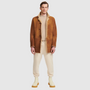 The Royce Toffee Shearling is a refined take on classic outerwear, crafted from ultra-light suede with a rich curly wool interior. Its single-breasted silhouette and stand collar with a short lapel create a clean, timeless profile, while a button closure ensures understated polish. Designed in a regular fit, this jacket offers both comfort and elevated versatility for everyday wear.