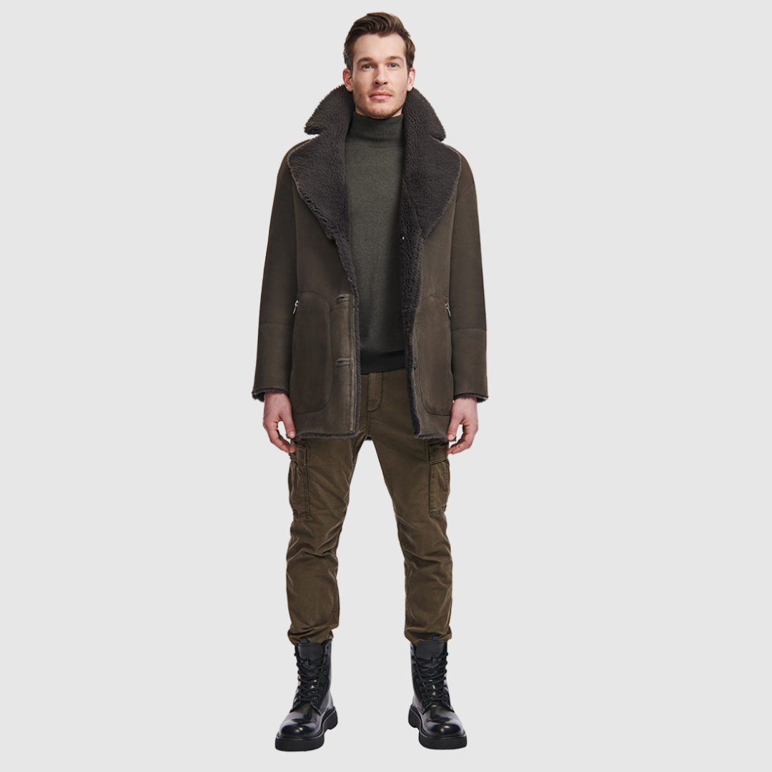 The Scorpio Cappuccino Reversible Shearling Jacket redefines versatility with a relaxed suede exterior that reverses to plush curly wool teddy. Designed with a drop shoulder and raw edge finish, it offers two distinct silhouettes: worn wool-in, it fits clean and structured through the shoulders and torso; worn wool-out, it delivers a more relaxed, effortlessly layered look. Finished with a notch collar, single-breasted button closure, and functional slash pockets on both sides.