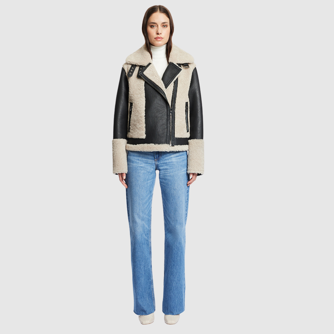 Nappa curly wool shearling Sleek nappa moto Drop shoulder Curly wool detail on body and sleeve cuff Curly wool collar with double buckle detail Asymmetrical front zip closure Side and interior zip pocket