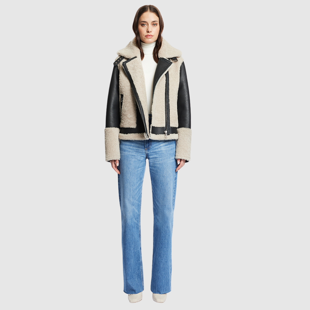 Nappa curly wool shearling Sleek nappa moto Drop shoulder Curly wool detail on body and sleeve cuff Curly wool collar with double buckle detail Asymmetrical front zip closure Side and interior zip pocket
