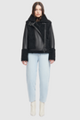 This sleek moto is designed with a high stand collar with double buckle detail and an asymmetrical front zip closure. Crafted in genuine shearling, the jacket is finished with side zip pockets and an interior pocket.