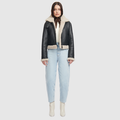  Nappa cropped moto  Regular shoulder  Curly wool collar and trims  Double buckle detail on collar  Straight fit through torso Exterior slash side pockets  Interior zip pocket  Front zip closure