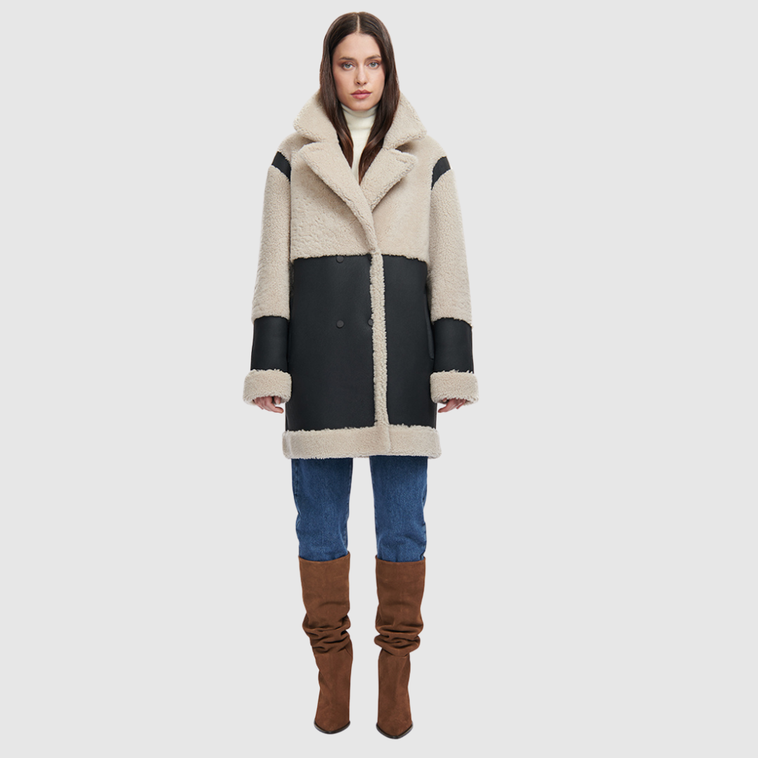 Reversible relaxed medium length nappa moto shearling Reverses to curly wool teddy  Drop shoulder Curly wool collar and trims Straight fit  Patch pockets on both skin-out and reversed wool-out sides Front zip closure