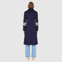 Italian wool cashmere blend Semi-fitted A-line silhouette Double breasted Regular shoulder Fitted through shoulders and arms, looser through torso Knit stripe detailing on arm Notch collar Slash pockets 