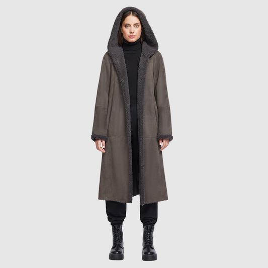 Reversible suede parka Reverses to a curly wool teddy Drop shoulder Fits comfortably through arms and torso Shawl collar with oversized hood Slash side pockets on both suede and curly wool side Snap button closure 