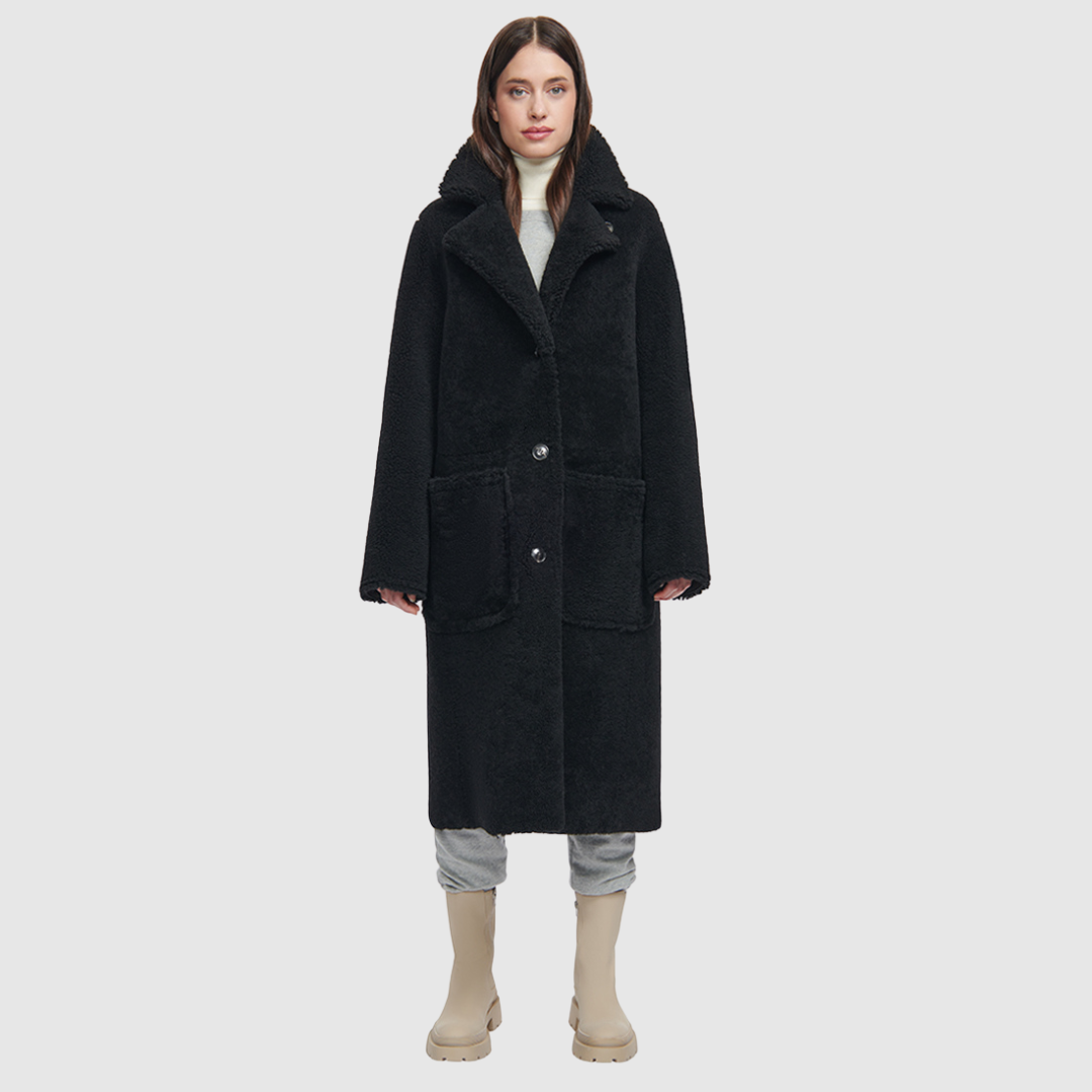 nappa curly wool shearling Vintage inspired reversible notch collar Reverses to curly wool teddy Relaxed dropped shoulder 3 button closure Tie belt at waist Zip pockets on suede side, reverses to patch pockets on teddy side