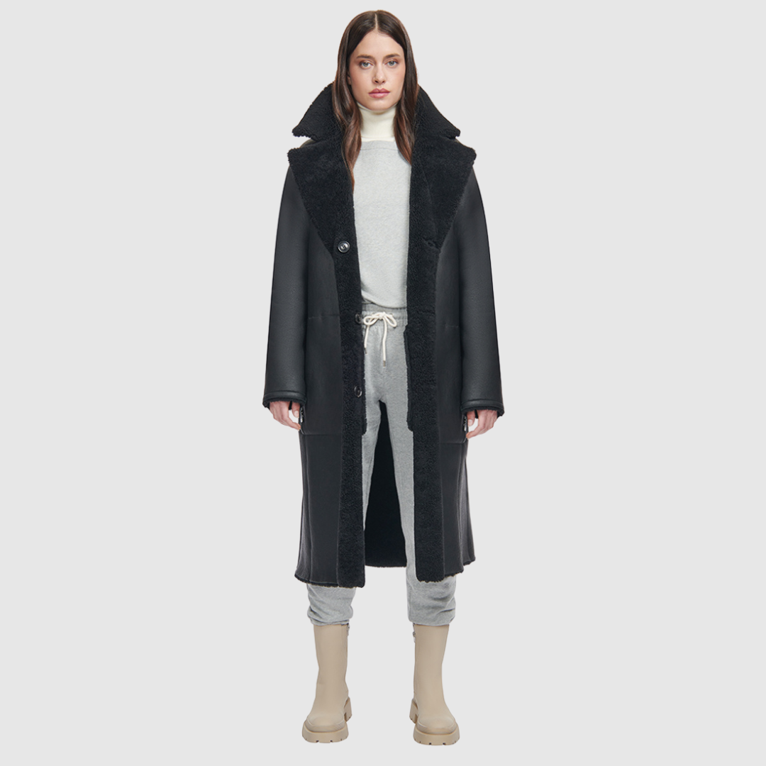 nappa curly wool shearling Vintage inspired reversible notch collar Reverses to curly wool teddy Relaxed dropped shoulder 3 button closure Tie belt at waist Zip pockets on suede side, reverses to patch pockets on teddy side