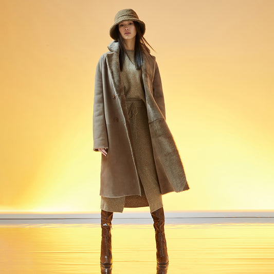 This elegant, reversible full-length shearling coat offers two beautiful styles in one. 51" long. It reverses from a beautiful nappa finish to a plush fur-out style and has two slip pockets.  Made from genuine Spanish merino shearling sheepskin. Double breasted. Slight dropped shoulder fits comfortably across the shoulders. Loose fit through the torso. 