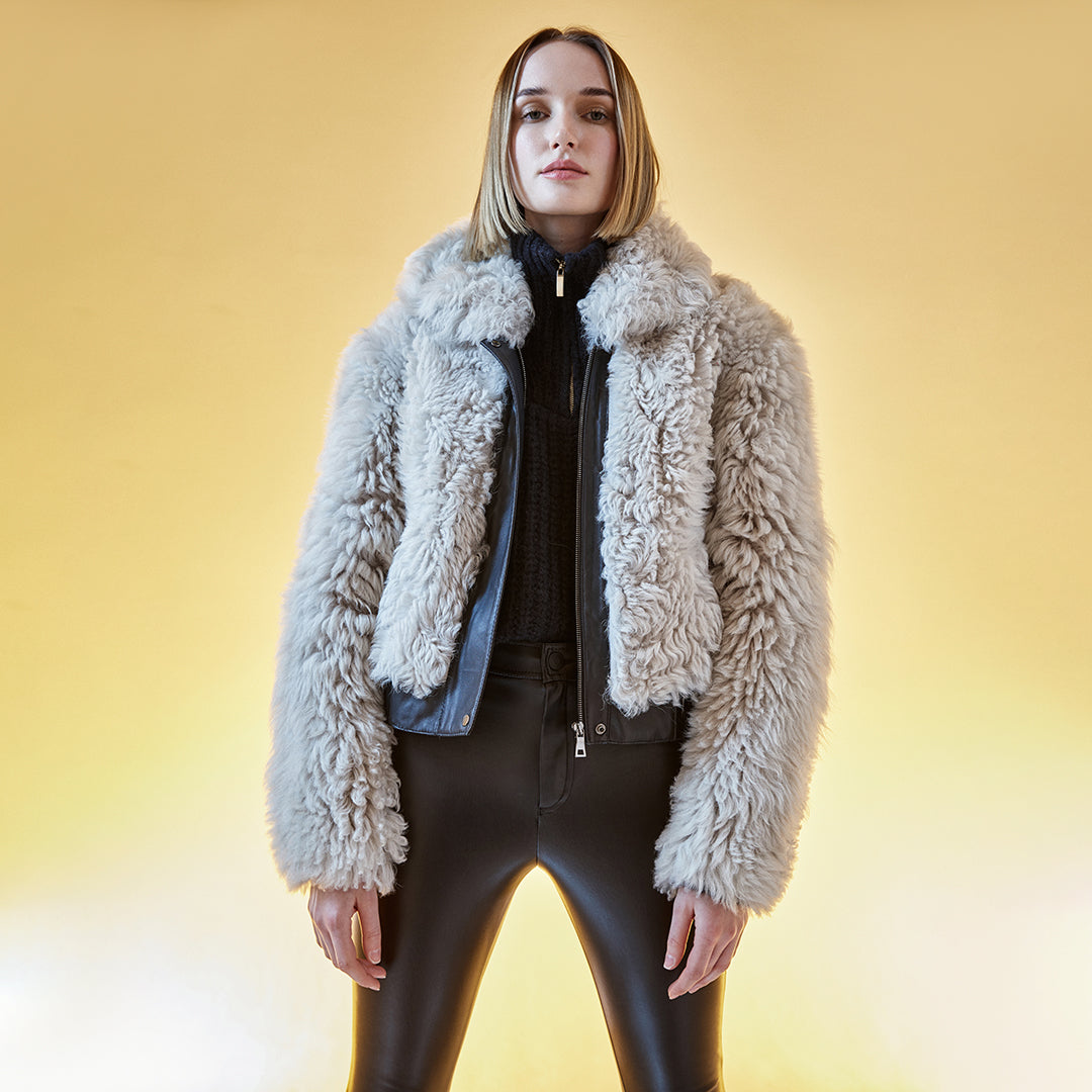  Curly wool bomber with nappa seam details. Relaxed shoulder Interior zip pocket
