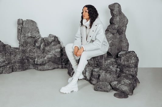 WHITE GLOSSY CURLY. Shearling. Reversible. Dropped shoulder and loose sleeves. Designed for a loose fit through frame with a boxy cut. Styled after the French bleu de travail or Chore jacket. 26 in