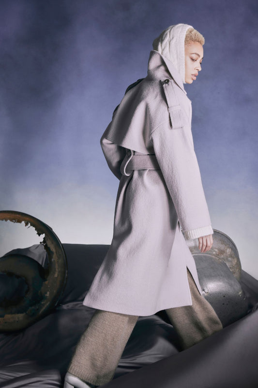 Double breasted oversized trench coat Notch collar Drop shoulder with oversized epaulets Storm-back with invisible center back zippered slit Relaxed fit with wide belt Made in Canada