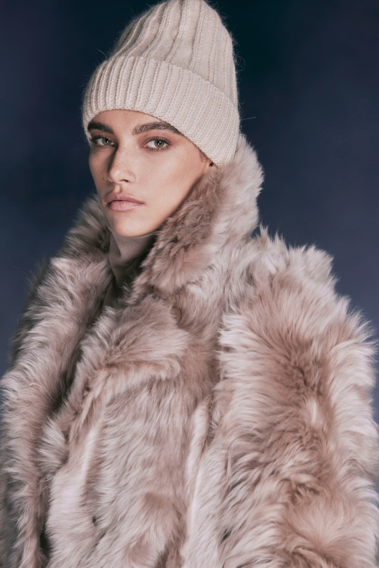 CAMEO ladiesƒ?? coat: a blend of warmth, designer flair, and practicality. Crafted from neutral suede toscana rasado wool-out mouton, this coat is both stylish and functional. It fits comfortably across the shoulders and is elegantly fitted through the torso. The snap closures provide ease of wear, while the exterior slash pockets and zip interior pockets offer convenience. At 35 inches in length, itƒ??s the perfect winter outerwear for chilly days and fashionable nights.