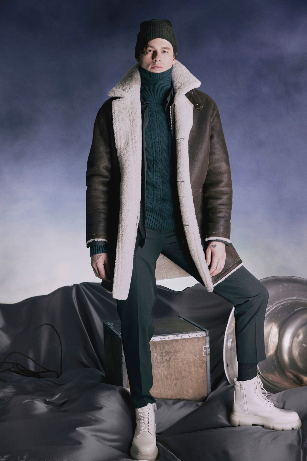 Explore winter in style with Chance, our designer mens shearling in arabica nappa coat. Reversible to a cozy curly wool teddy, it's warm and versatile. True to size, it fits comfortably with a loose fit through the torso and fits snugly across the shoulders. This 37" inch coat features a zip closure, 3-button closure, notch collar, and practical slash and patch pockets.