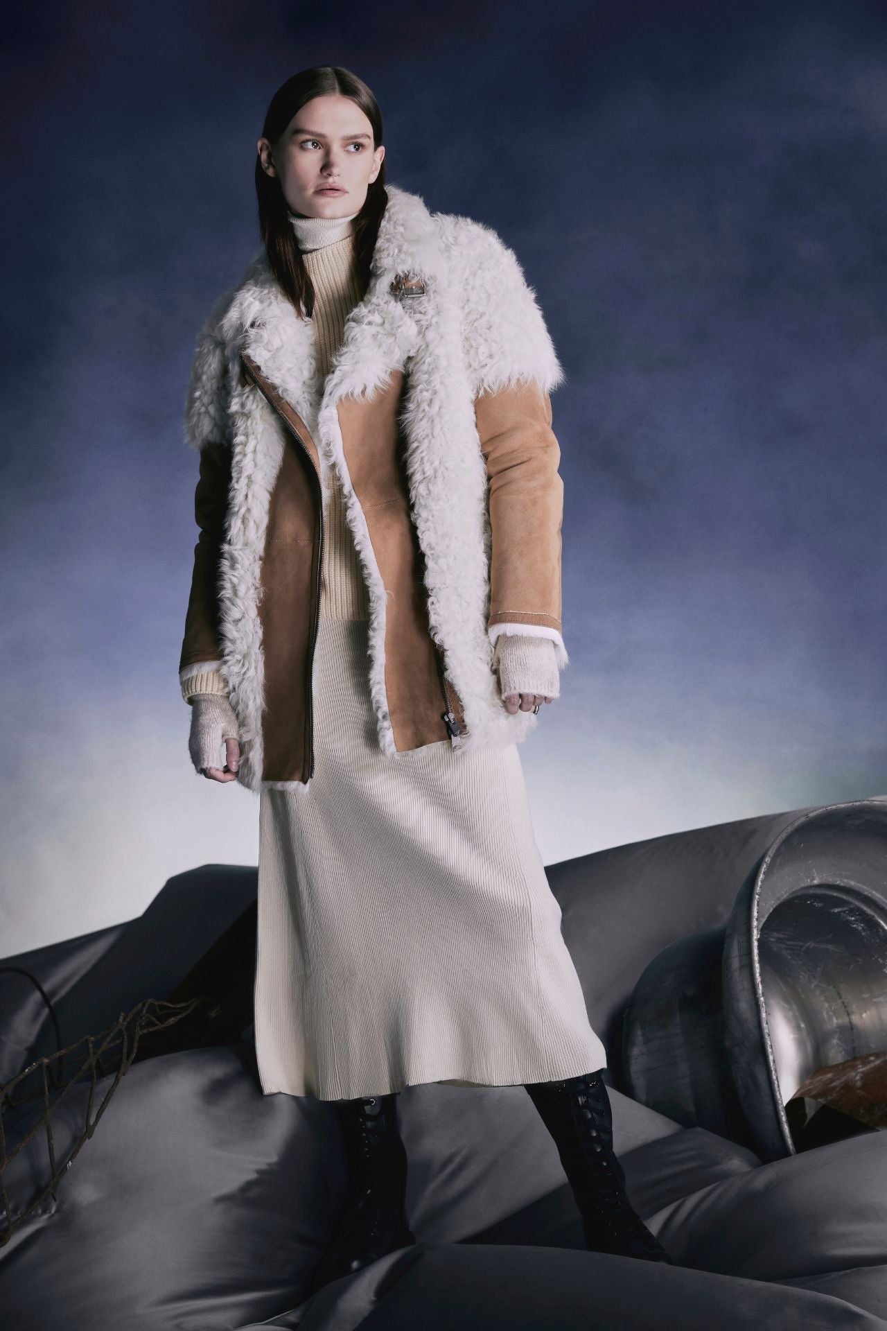 This stylish jacket is designed with an asymmetrical zip closure and waterfall collar. Crafted in genuine shearling, the jacket is finished with side zip pockets and double buckle detail at the collar. Genuine Shearling Waterfall collar Long-sleeve Zipper closure