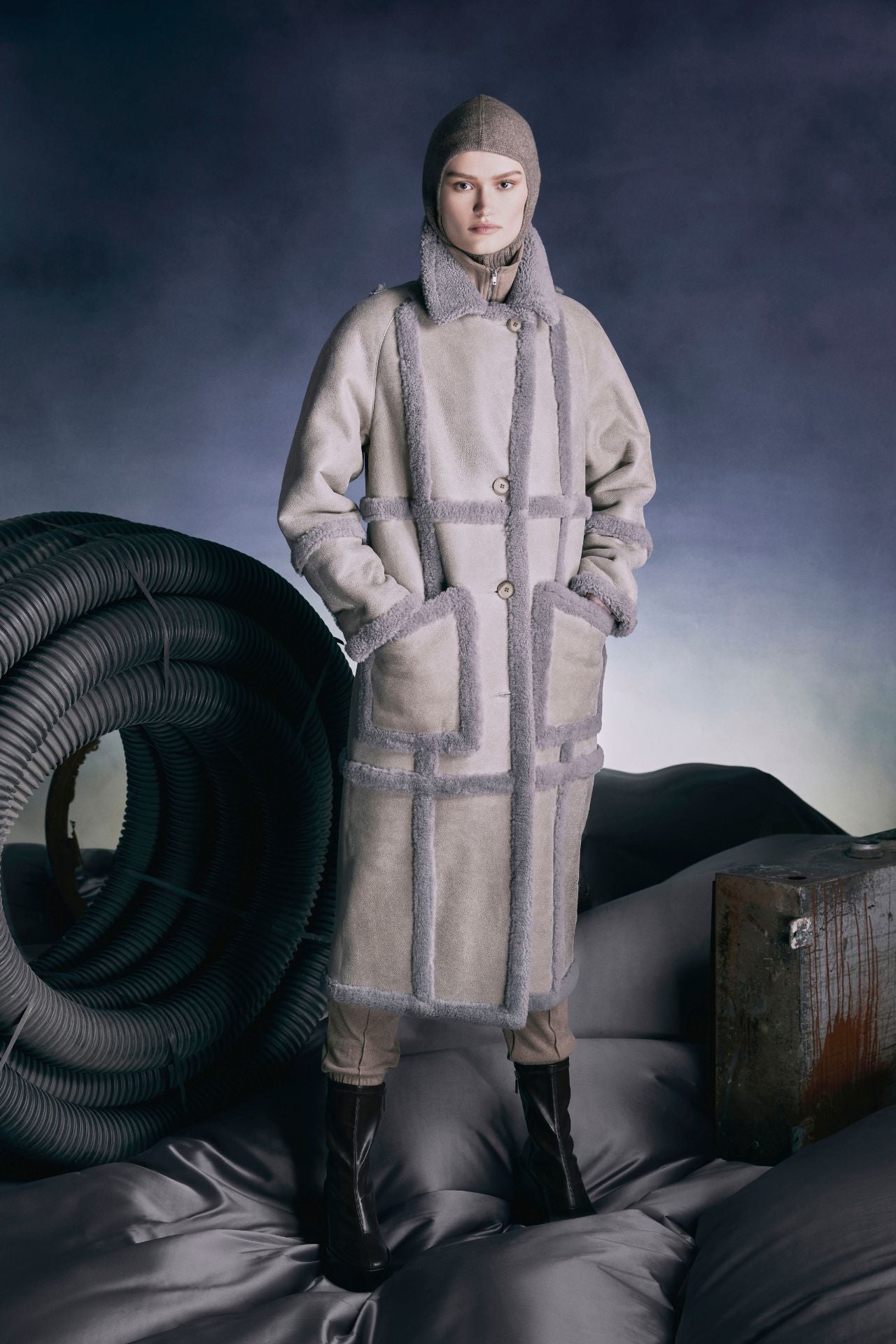 Introducing STEM, a vintage-inspired reversible suede coat designed to elevate your winter wardrobe. This timeless piece seamlessly transitions from a classic suede finish to a cozy curly wool teddy style, offering versatility for any occasion. Featuring contrast curly wool seam detailing, drop shoulder design, and button closure, it exudes sophistication and comfort. Complete with oversized patch pockets, STEM is the perfect outerwear essential to keep you stylish and warm throughout the winter season.