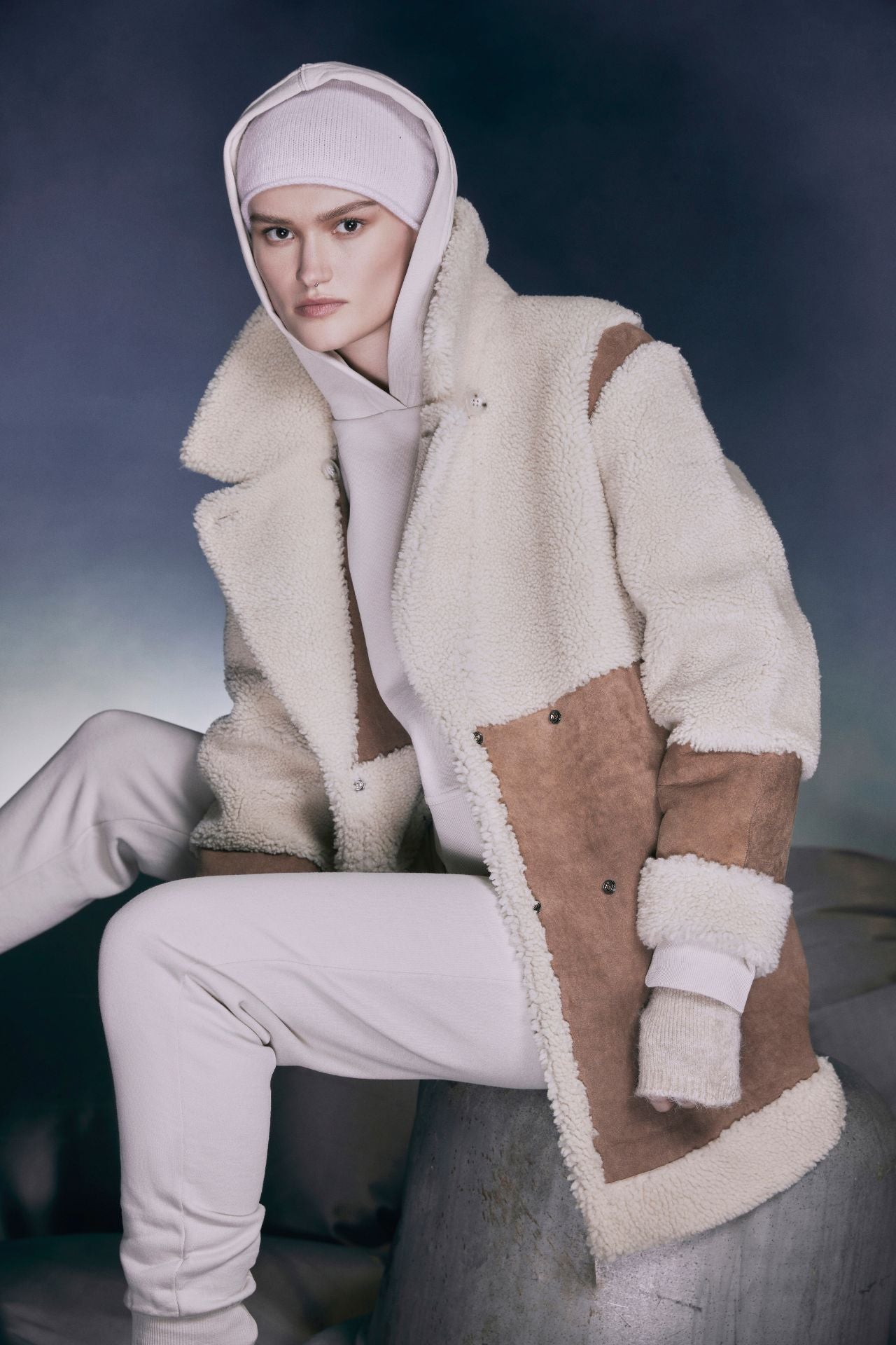 Introducing URBAN by HiSOƒ??a ladies' Cashew antique curly wool shearling, the epitome of urban chic. This reversible coat features an oversized nappa and curly wool combination, seamlessly transitioning to a striking contrast placement. With a relaxed drop shoulder fit, snap closure, and single welt side pockets, it's both stylish and functional. Elevate your winter wardrobe with this versatile outerwear essential, perfect for staying warm and fashionable in the city streets.